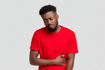 Fototapeta premium a men with stomache pain holding his belly