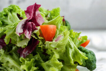 Fresh green salad with red leaf lettuce and cherry tomatoes