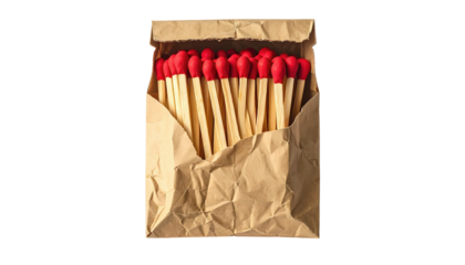 Matches with red tips in a brown crinkled paper bag, top view, against a black background