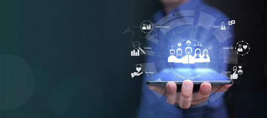 Businessman using tablet with digital CRM, customer relationship management system interface showing customer insight, analytics, retention, and engagement in modern digital marketing strategy.