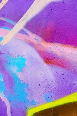 Colorful graffiti with neon purple, blue, splashes of vibrant colors. Urban 2000s style, iridescent feel, dynamic composition. Creative backdrop, street art, digital design, modern 2000s flair.