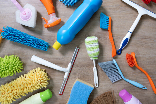 House cleaning plastic product on wood table background, home service or housekeeping concept