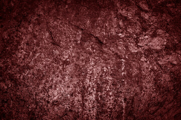 Textured red rock surface with rough, natural details.