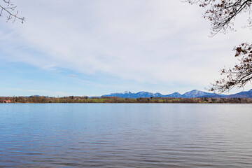 View over the Staffelsee in Bavaria from Uffing to the opposite shore and the Kochel mountains in the Alps