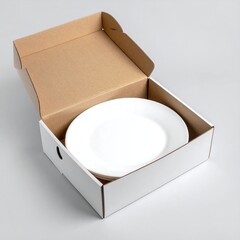 White plates stacked in a cardboard box with lid open