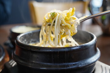 Steaming Korean Bean Sprout Soup in a Traditional Stone Pot