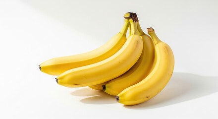 A bunch of ripe yellow bananas isolated on a white background, natural soft light, minimal shadow, clean composition, high resolution, professional food photography.