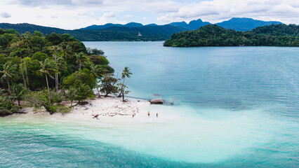 Nestled in the sparkling waters of Koh Chang Thailand, Phrao Nok Island offers stunning views, lush greenery, and soft sandy beaches. Visitors can relax in this tranquil paradise surrounded by nature.