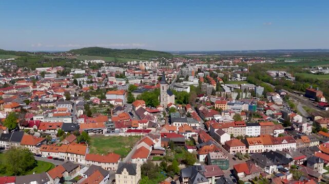 Cinematic aerial drone approach toward the historic Gothic St Mary's Church in UNESCO World Heritage Site Kutna Hora, Czechia.