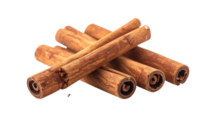 Rolled cinnamon sticks pile on black. Warm, natural hues. Abstract patterns form at ends
