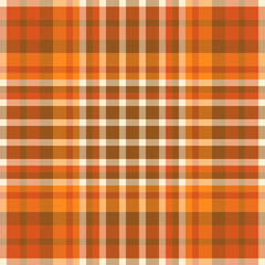 Warm autumnal plaid pattern. Seamless tartan texture in hues of orange, brown and beige. Textile background for fashion, home decor, or rustic design projects.