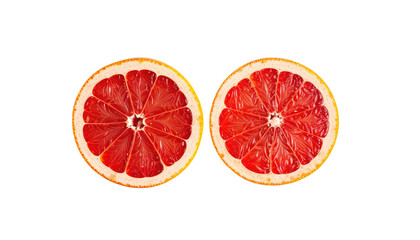Two halved grapefruit slices facing upward with red flesh against a contrasting black background