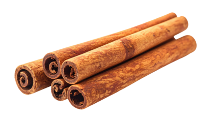 Group of cinnamon sticks, close-up view against black background, showcasing the rolled bark texture and warm colors