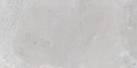 Fototapeta premium The rough surface of a stone slab with a concrete hue. Design for porcelain tiles