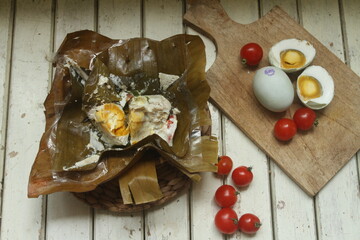 asem-sem telur asing on banana leaf