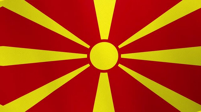 Flag of North Macedonia with a yellow sun and rays on a red background.