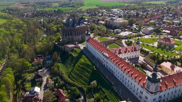 High altitude drone shot descending toward the historic Jesuit College and St. Barbara Church in UNESCO city Kutna Hora, Czechia.