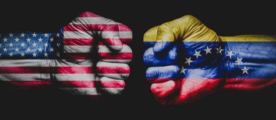 Obraz premium american and venezuela flag overly on fist. us flag against venezuela flag. concept of war between united states and venezuela
