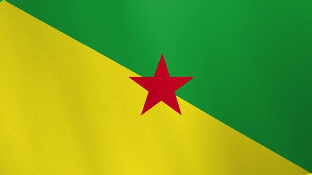 Close-up view of the vibrant flag of French Guiana, featuring a diagonal split of green and yellow with a central red star.