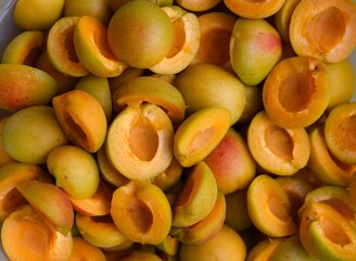 Close-up shot of fresh halved apricots background