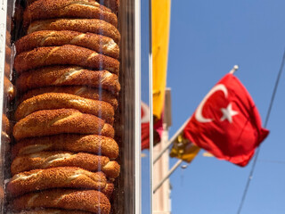 Close up of Simit bagels and Turkish flag reflecting local culture and identity