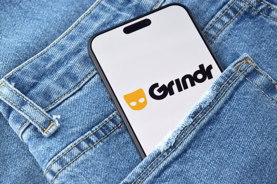 Grindr dating app on smartphone screen.