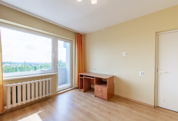 Minimalism Home Bedroom Interior. Closet, Hardwood Floor. Sofa Couch. Heater and Window in Background