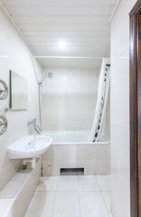 Bright Elegant Home Bathroom Interior Design With White Sink. Mirror and Faucet.