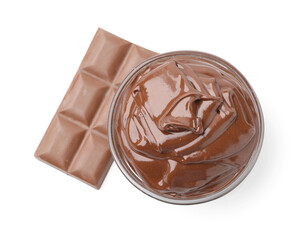Bowl with melted chocolate and bar isolated on white, top view