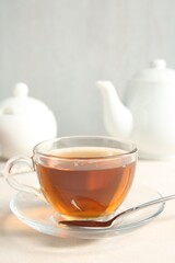 Delicious tea served on white table. Space for text