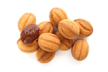 Delicious nut shaped cookies with boiled condensed milk isolated on white, top view