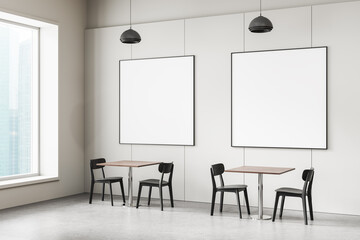 Modern minimalist cafe interior with two empty framed posters for mockup on bright wall and clean seating layout under pendant lighting. 3D Rendering