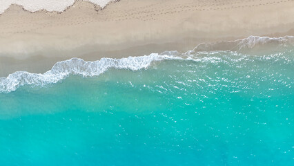 Aerial View of Turquoise Shoreline in a tropical Beach waves and Ocean
