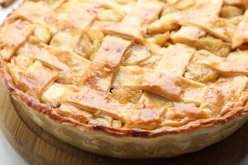 Delicious homemade apple pie on white table, closeup