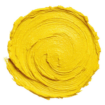 A thick textured swirl of vibrant yellow paint in a circular pattern isolated on a black background