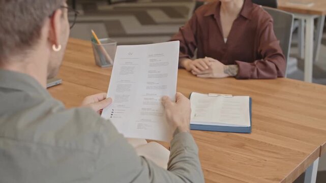 Confident Candidate Hands CV to HR Manager During Job Interview Slow Motion