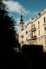 Naklejka premium Two shepherd dogs - Australian and German joyfully play and splash in a clear mountain river surrounded by rocks and forest greenery. Vertical 4k footage. Georgia country