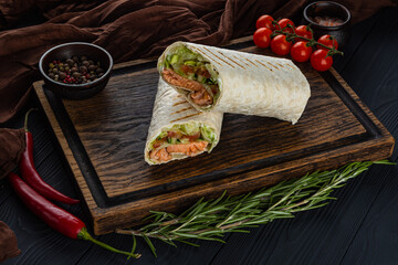 Doner, shawarma with salmon on a wooden tray