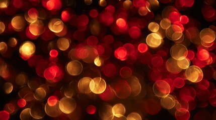 Close-up of out-of-focus red and gold circular highlights, floating against a black background. Suggests festive, warm ambiance