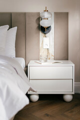 Luxurious hotel bedroom with modern furniture and elegant decor features