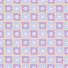 A seamless cute floral pattern featuring pastel blue and pink flowers arranged in a soft geometric layout