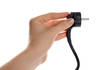 Woman holding electrical wire with plug on white background, closeup