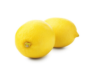 Two whole ripe lemons isolated on white