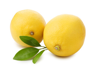 Two whole ripe lemons and leaves isolated on white