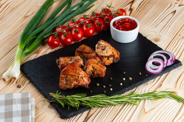 Grilled pork shashlik on a wooden table