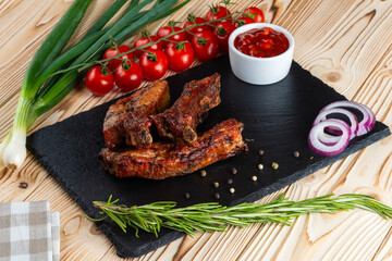 Grilled ribs, shashlik on a wooden table