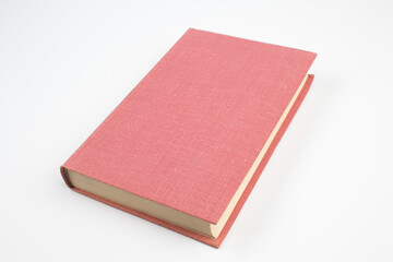 Open bright pink book isolated on white background.