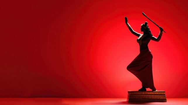 Graceful silhouette of a dancer with sword on red background showcasing movement and traditional culture in artistic performance