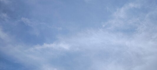 Background with clouds on blue sky. Sky view. Beautiful sunny sky.