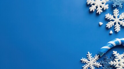 Blue Background with Snowflakes and Candy Cane for Holiday and Festive Celebrations